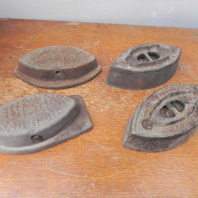 LOT 255  FOUR CAST IRON CLOTHES IRONS