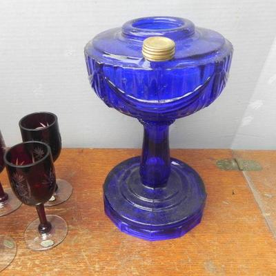 LOT 252  BLUE GLASS OIL LAMP & PURPLE ETCHED STEMWARE