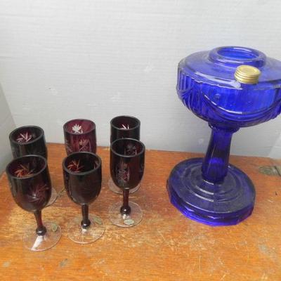 LOT 252  BLUE GLASS OIL LAMP & PURPLE ETCHED STEMWARE