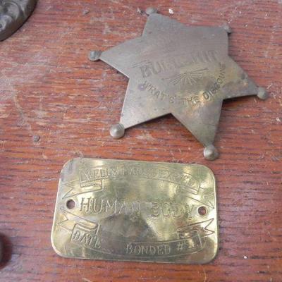 LOT 247  TWO DOOR RINGERS,COIN BANK AND BRASS BADGES