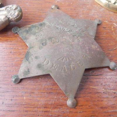 LOT 247  TWO DOOR RINGERS,COIN BANK AND BRASS BADGES