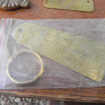 LOT 247  TWO DOOR RINGERS,COIN BANK AND BRASS BADGES