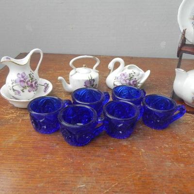 LOT 243  CHINA TOY TEA SET AND BLUE GLASS TOY TEACUPS