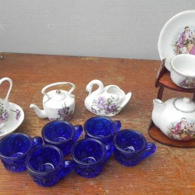 LOT 243  CHINA TOY TEA SET AND BLUE GLASS TOY TEACUPS