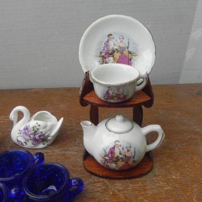 LOT 243  CHINA TOY TEA SET AND BLUE GLASS TOY TEACUPS