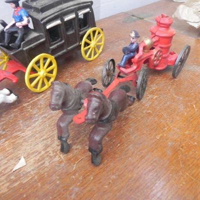 LOT 242  CAST IRON TOY STAGECOACH, FIRE TRUCK & CAR