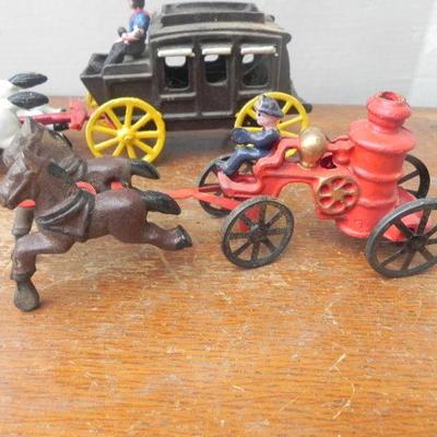LOT 242  CAST IRON TOY STAGECOACH, FIRE TRUCK & CAR