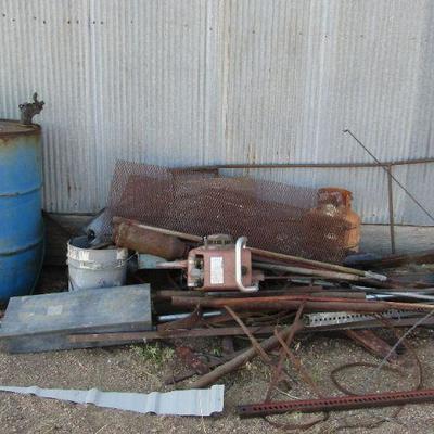 F-16  SCRAP PILE BY BIG BUILDING