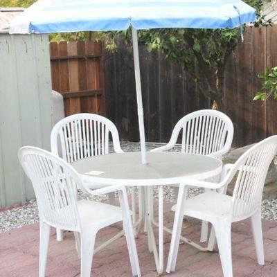 Lot 172 Glass Patio Table w/ 4 Plastic Chairs & Umbrella