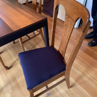 1.  Laminated wood dining table with two leaves, pads and 6 oak chairs