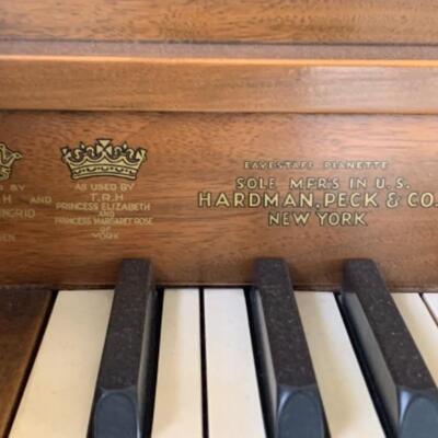 2. Hardman, Peck & Company Minipiano with bench, music, metronome and desk lamp (55.5” x 36” x 17”)