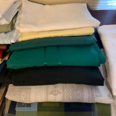 15. Large collection (18 pieces) of table linens (up to 108” in length) in assorted colors and fabrics