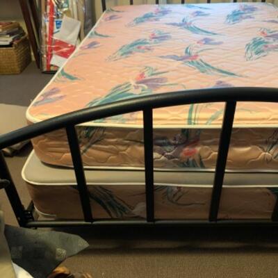 17. Full-size bed in black metal frame (pristine)