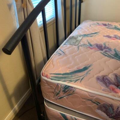 17. Full-size bed in black metal frame (pristine)