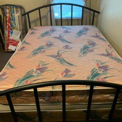 17. Full-size bed in black metal frame (pristine)