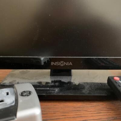 25. Flatscreen Insignia television (19-inch) with speakers and power cord