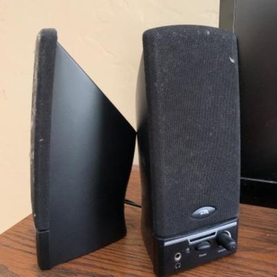 25. Flatscreen Insignia television (19-inch) with speakers and power cord