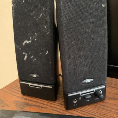 25. Flatscreen Insignia television (19-inch) with speakers and power cord