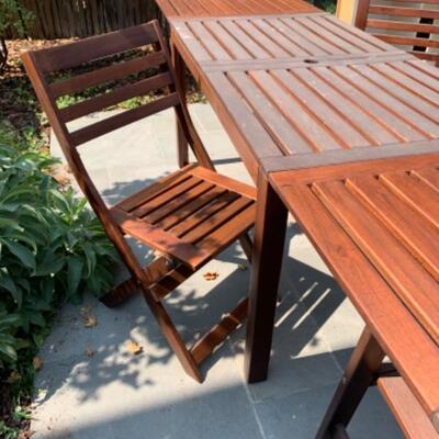 62. Teak picnic table with four chairs (folded:  55”x30”x28.5; leaves measure 23.5” each)