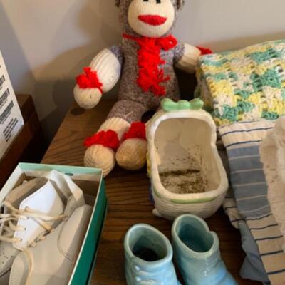 68.  Vintage infant blankets, toy, baby shoes, vases, etc.