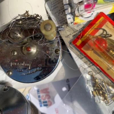 75.  Large collection of fishing gear:  poles, reels, lures, hooks, waders, etc.