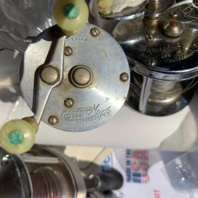 75.  Large collection of fishing gear:  poles, reels, lures, hooks, waders, etc.