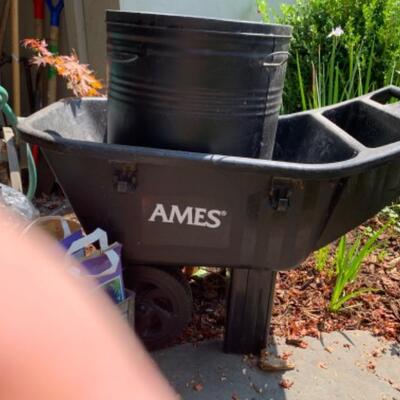 77.  Wheelbarrow, hose, holder, garden drum, bulbs, etc.