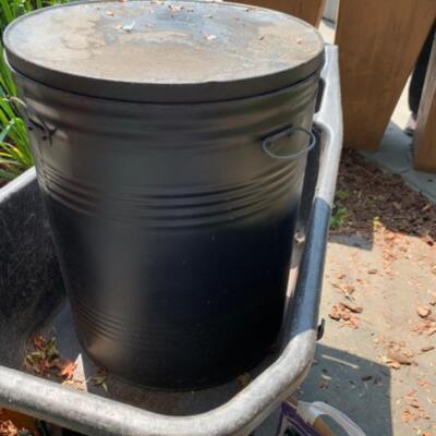 77.  Wheelbarrow, hose, holder, garden drum, bulbs, etc.