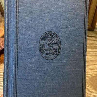 W54: Painting, Candle Jar, and Vintage Book