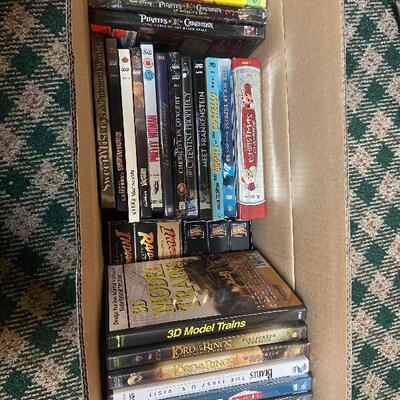 P124:  Lot of DVDs, Blu-ray's, and VHS
