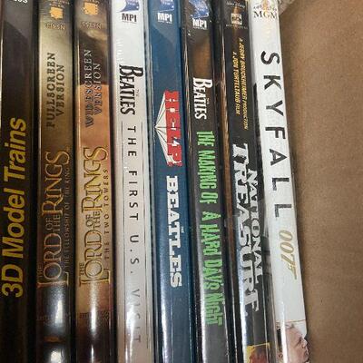 P124:  Lot of DVDs, Blu-ray's, and VHS