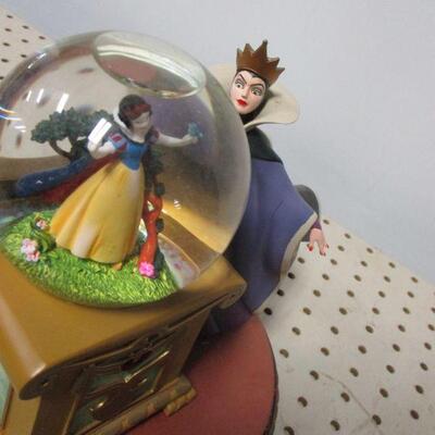 Lot 46 - Disney Villains Evil Queen Crystal Ball Snow White Spinning Snow Globe
