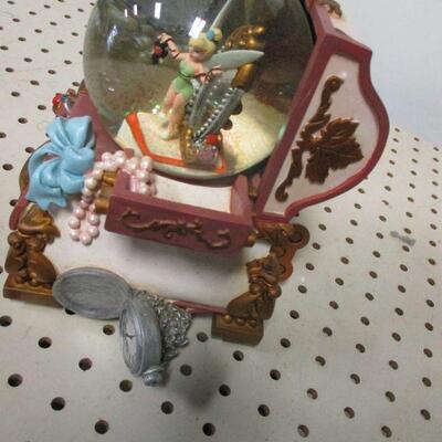 Lot 76 - Disneys Tinker Bell Hidden Treasure Chest Snow Globe w/ Musical Jewelry Box