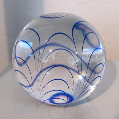 Glass paper weights with brilliant blue swirl pattern
