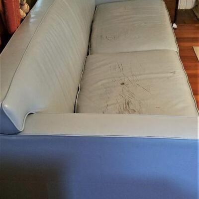 Lot #141  Teal Leather Sofa - some damage