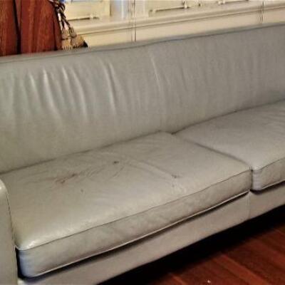 Lot #141  Teal Leather Sofa - some damage