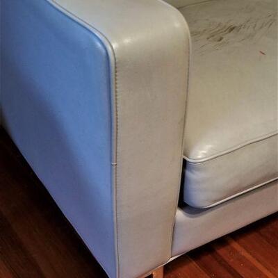 Lot #141  Teal Leather Sofa - some damage