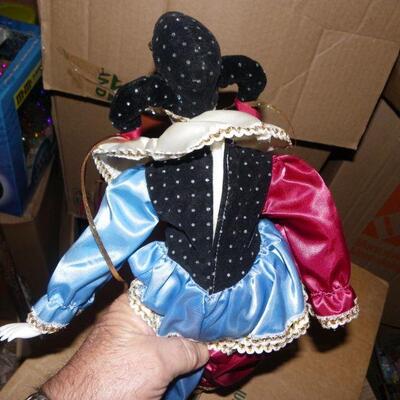 ' Porcelain female clown doll, 10 inches.