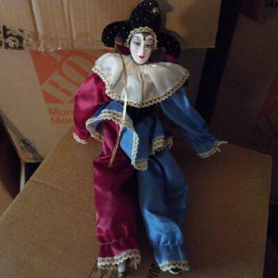 ' Porcelain female clown doll, 10 inches.