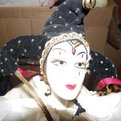 ' Porcelain female clown doll, 10 inches.