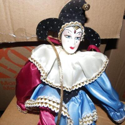 ' Porcelain female clown doll, 10 inches.