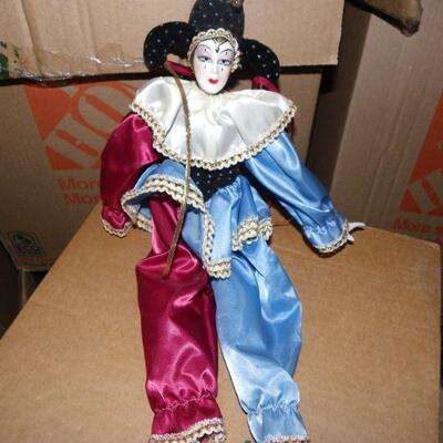 ' Porcelain female clown doll, 10 inches.