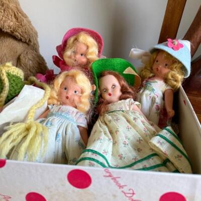 49. Assorted bric-a-brac (figurine, Nancy Ann dolls, wood carving, baby quilt, binoculars, bears, clock, beads, etc.)