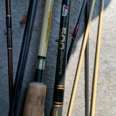 75.  Large collection of fishing gear:  poles, reels, lures, hooks, waders, etc.
