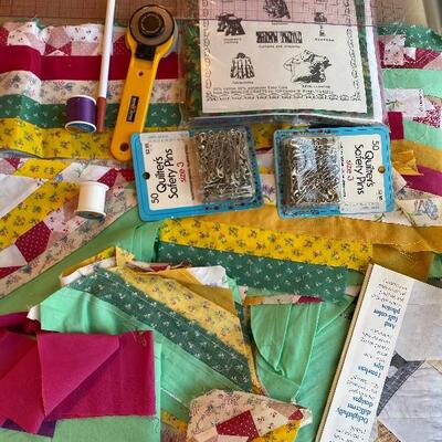 Quilters lot including pieced squares ruler safety pins and precut pieces