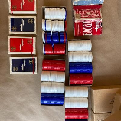 Four boxes of poker chips seven boxes of cards