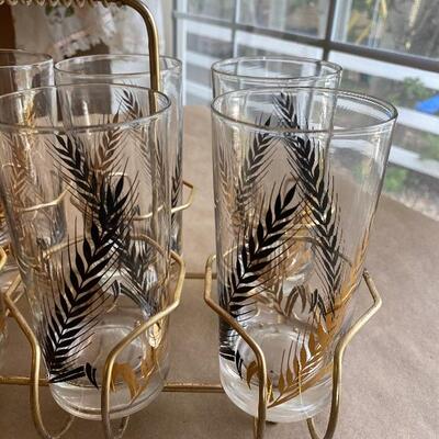 Vintage eight glass set in holder Mid Century beauties