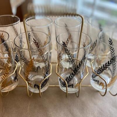Vintage eight glass set in holder Mid Century beauties