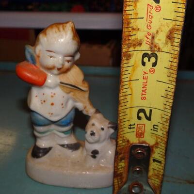 Little Boy Figure playing Violin to his Terrier Dogie 