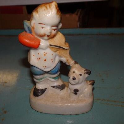 Little Boy Figure playing Violin to his Terrier Dogie 